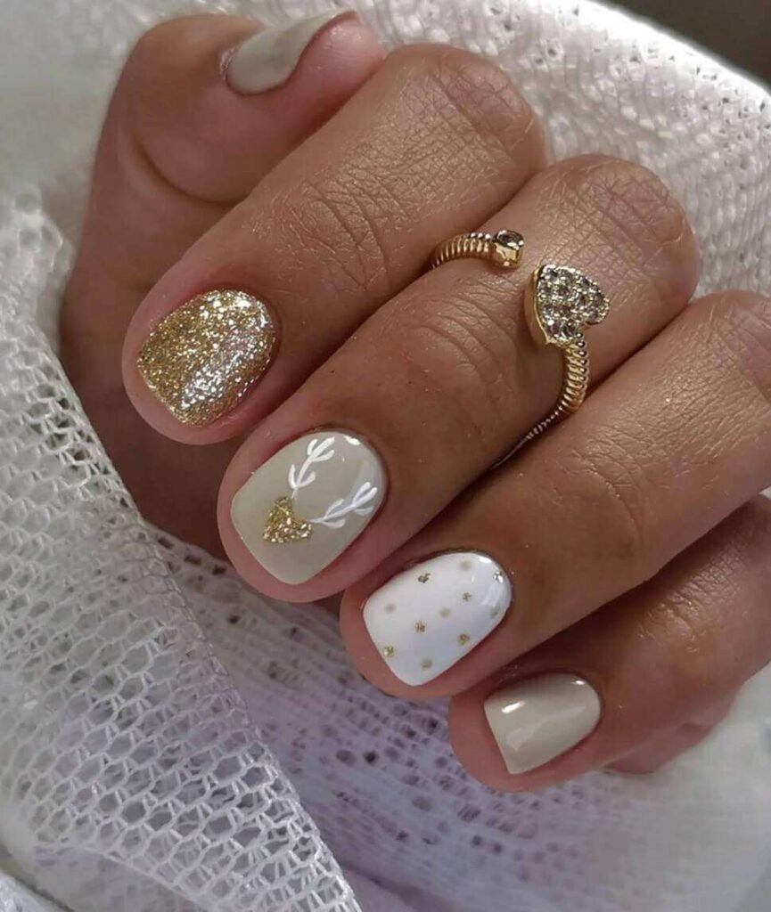 white and gold christmas nails
