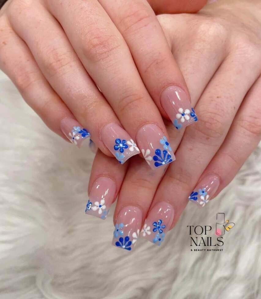 square blue and white floral nails