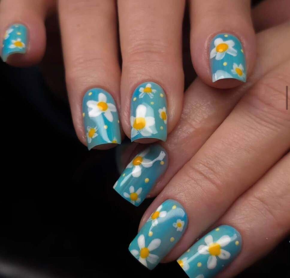 square blue and white floral nails