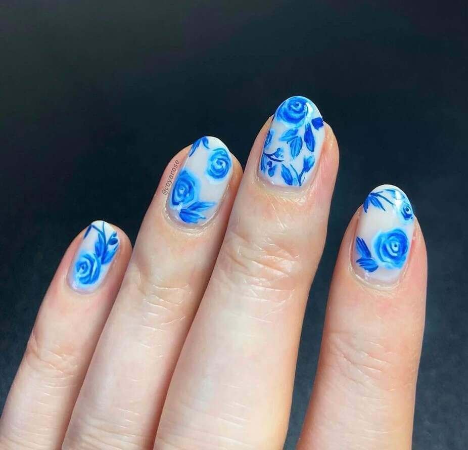 short blue and white floral nails
